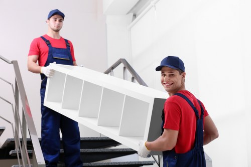 Moving team handling home removals on an Islington street