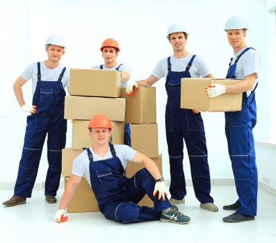 Careful loading of household items for a move in Islington