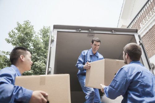 Furniture collection team handling a sofa pick-up in Islington