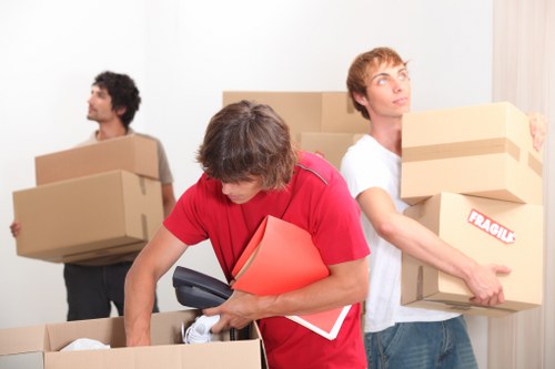 Packing and loading household items into a van in Islington