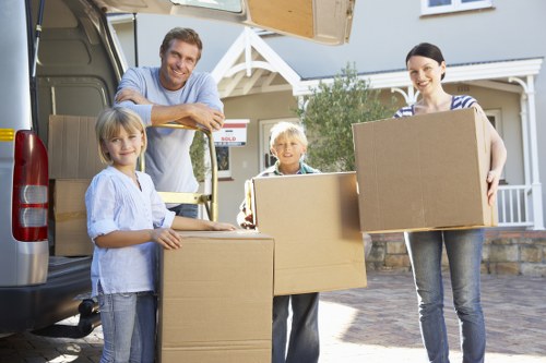 Packed moving boxes and furniture ready for transport in an Islington home