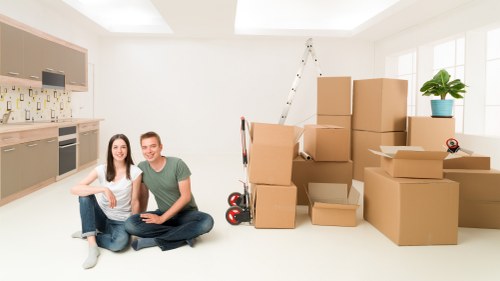 Mover loading furniture and boxes for a local Islington removal job