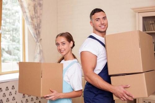 Loading household items into a moving van with care