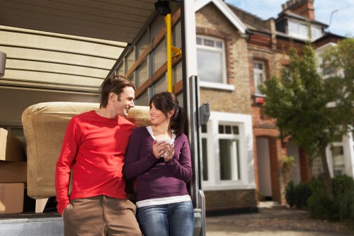 Removal van loading outside an Islington flat with stair access